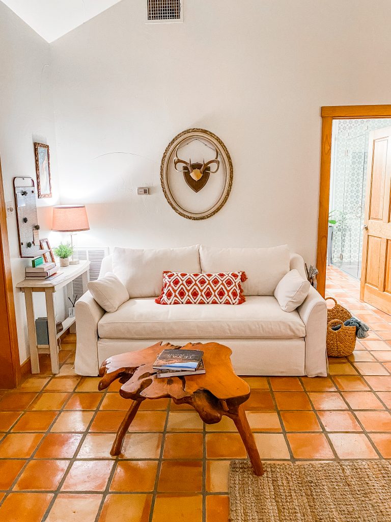 couch/love seat and decor in emma haus fredericksburg luxury vacation rental, airbnb rental in fredericksburg tx, charming rental in texas hill country